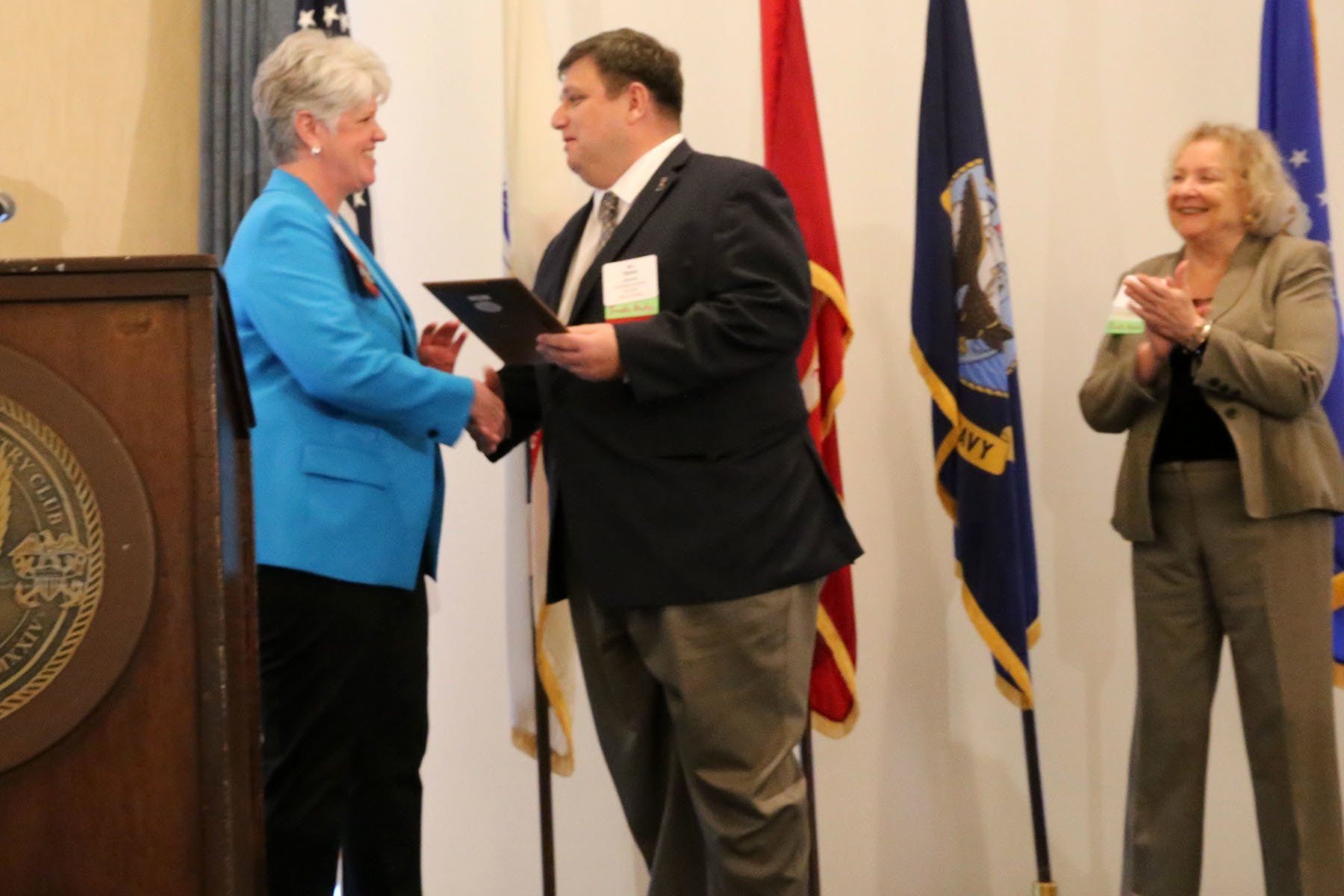 Receiving plaque from director image