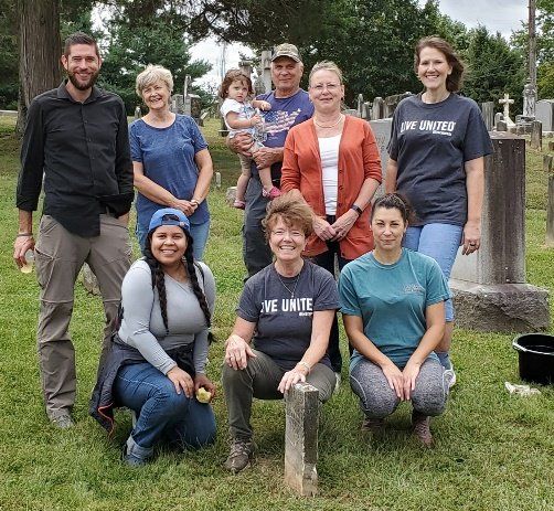 Group photo of Syntelligent employees volunteering