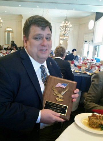 CEO Steve Synnott with plaque