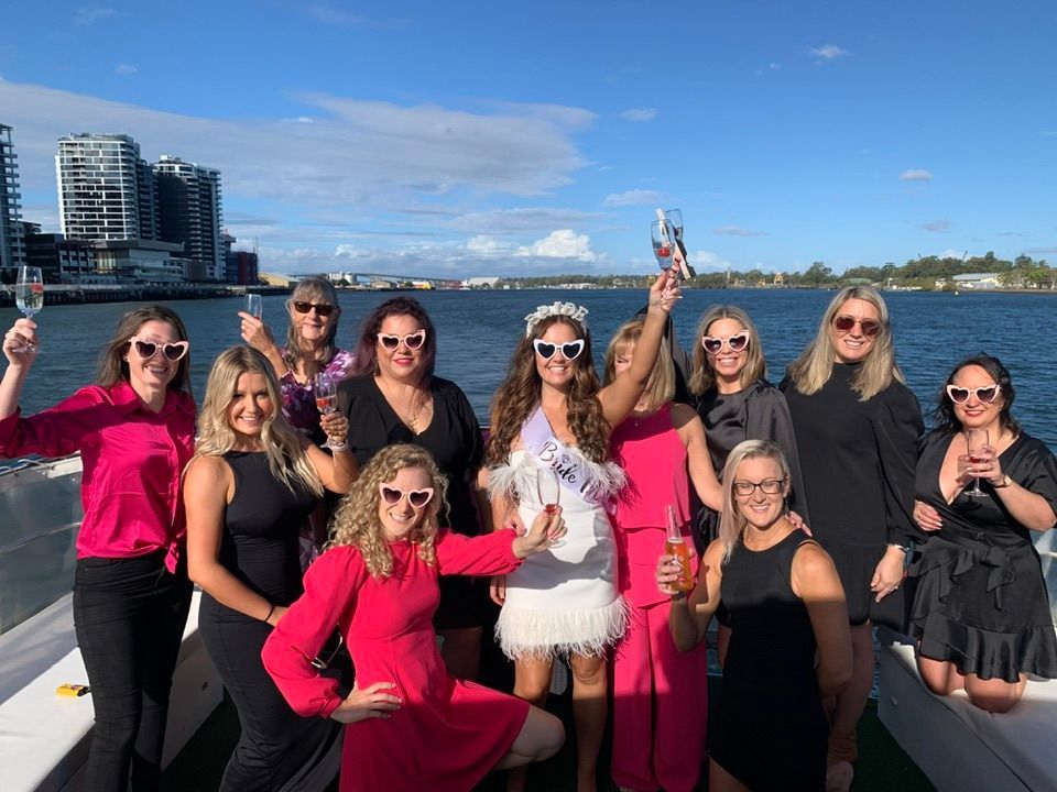 Lively group celebrating a hen's night party onboard a private Brisbane River party cruise.