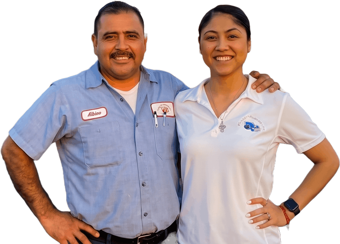 Two smiling employees in light blue and white uniforms standing together with hands on hips