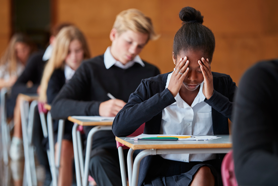 Kids in a classroom taking a tough test