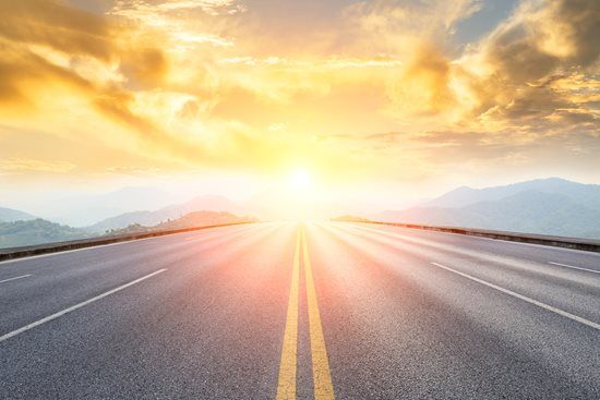 Sunrise over a road