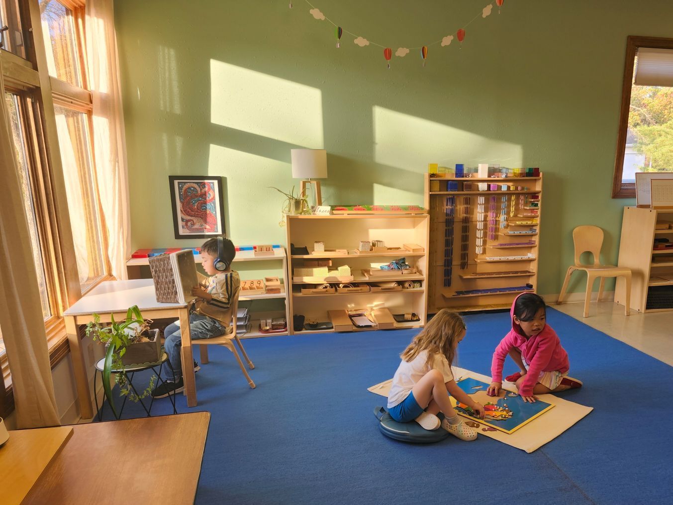 Students work peacefully in their Montessori Primary environment.