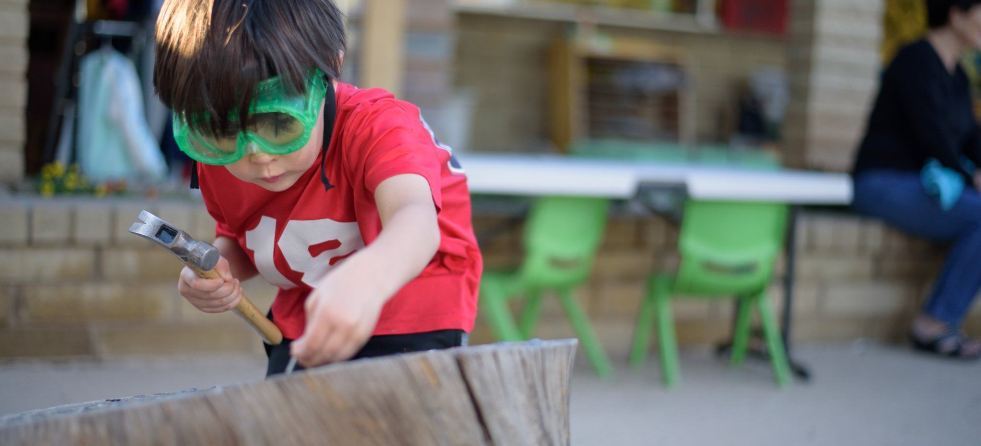 Young child using a hammer