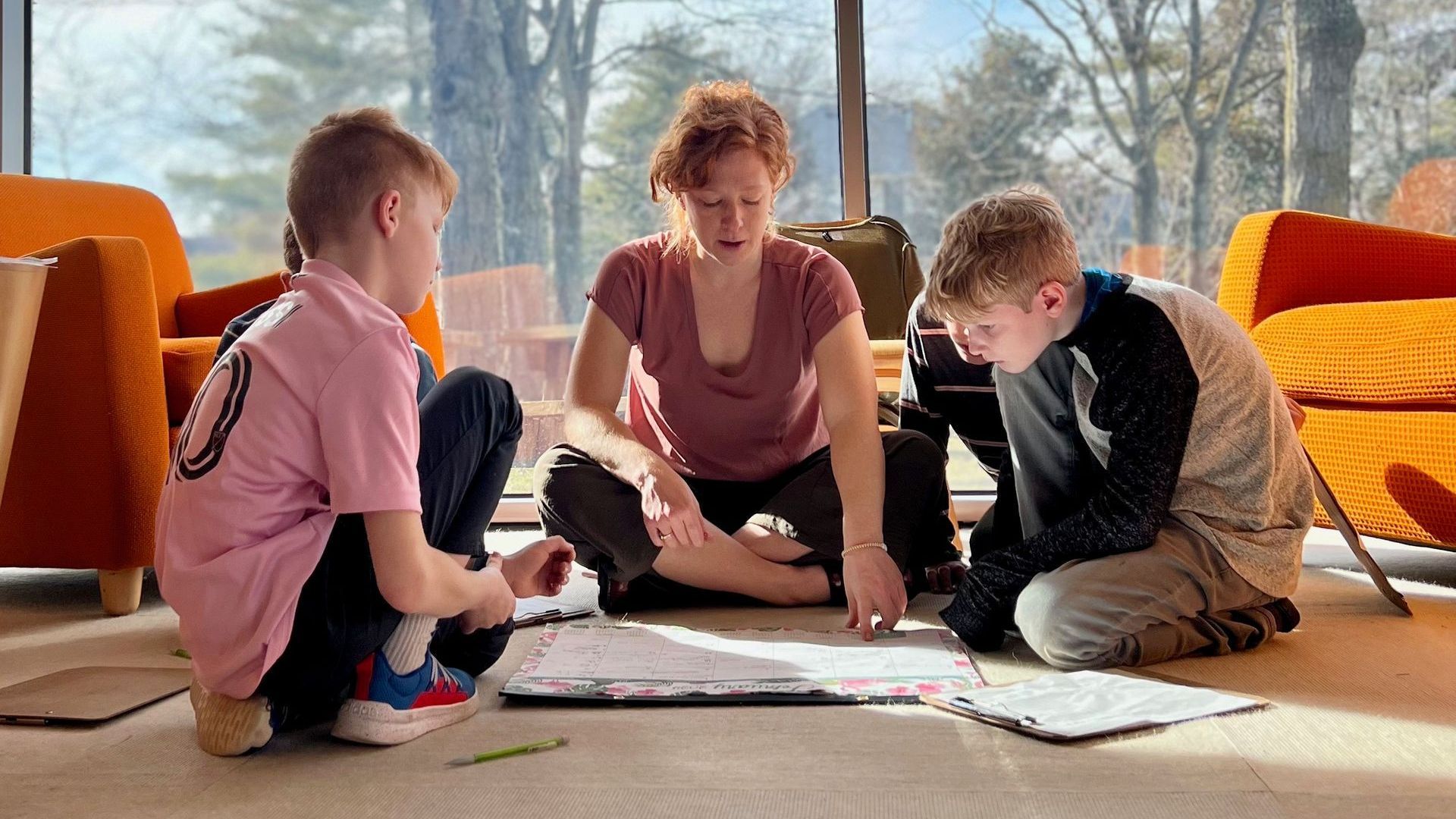 Montessori guide and children in the classroom