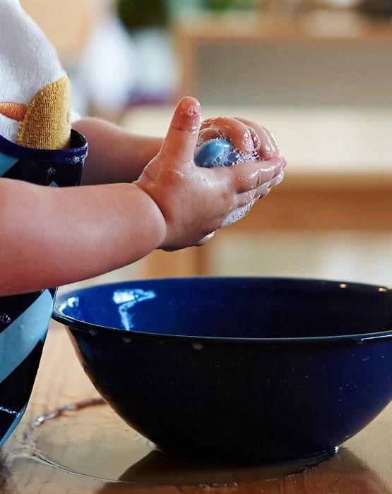 Montessori child working on practical life skills