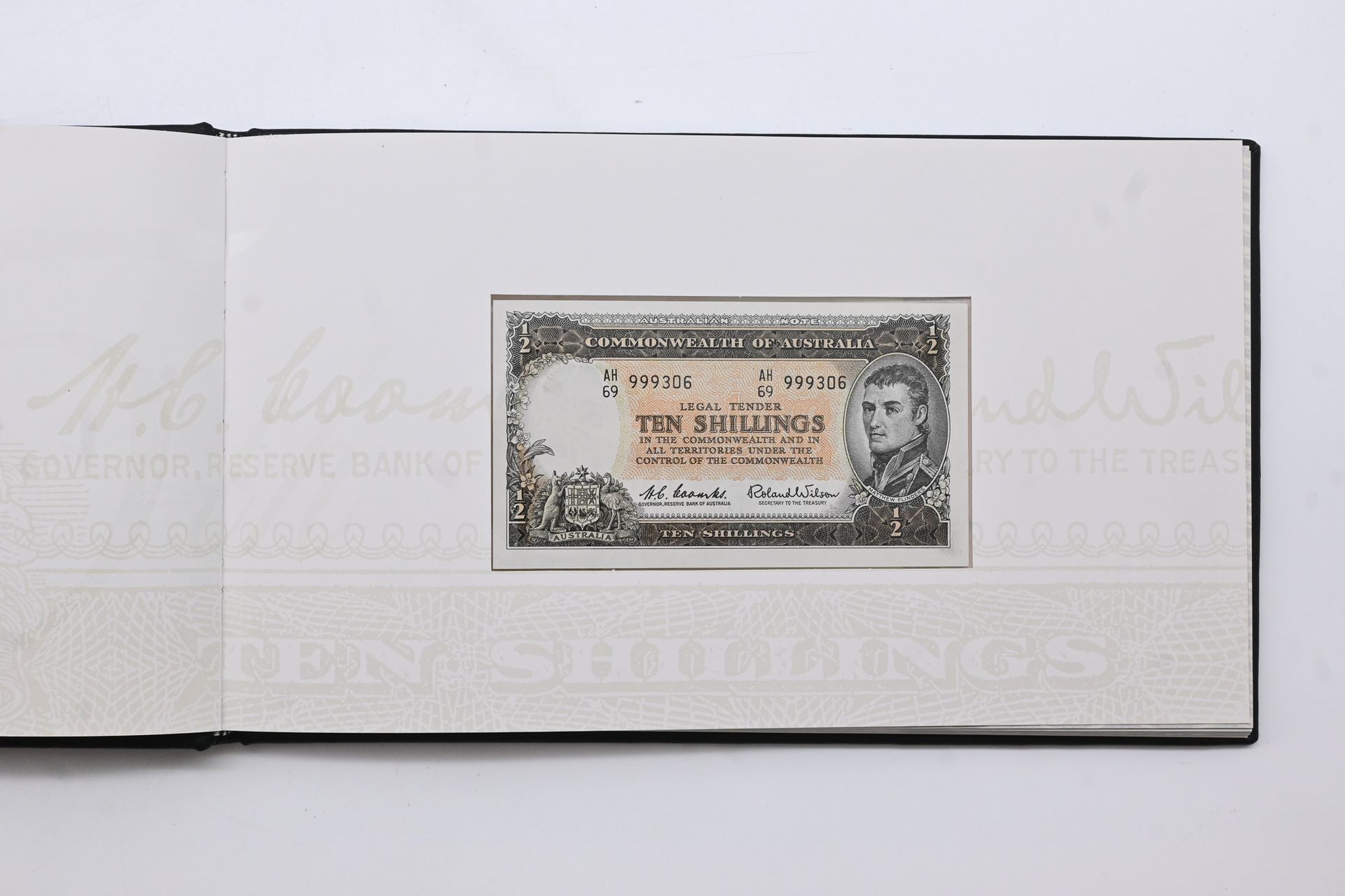 1991 25th Anniversary of Decimal Currency banknote portfolio pairing the final pre-decimal and first decimal notes with matching serial digits, Lot 723 at Copeland Roberts Auction 020