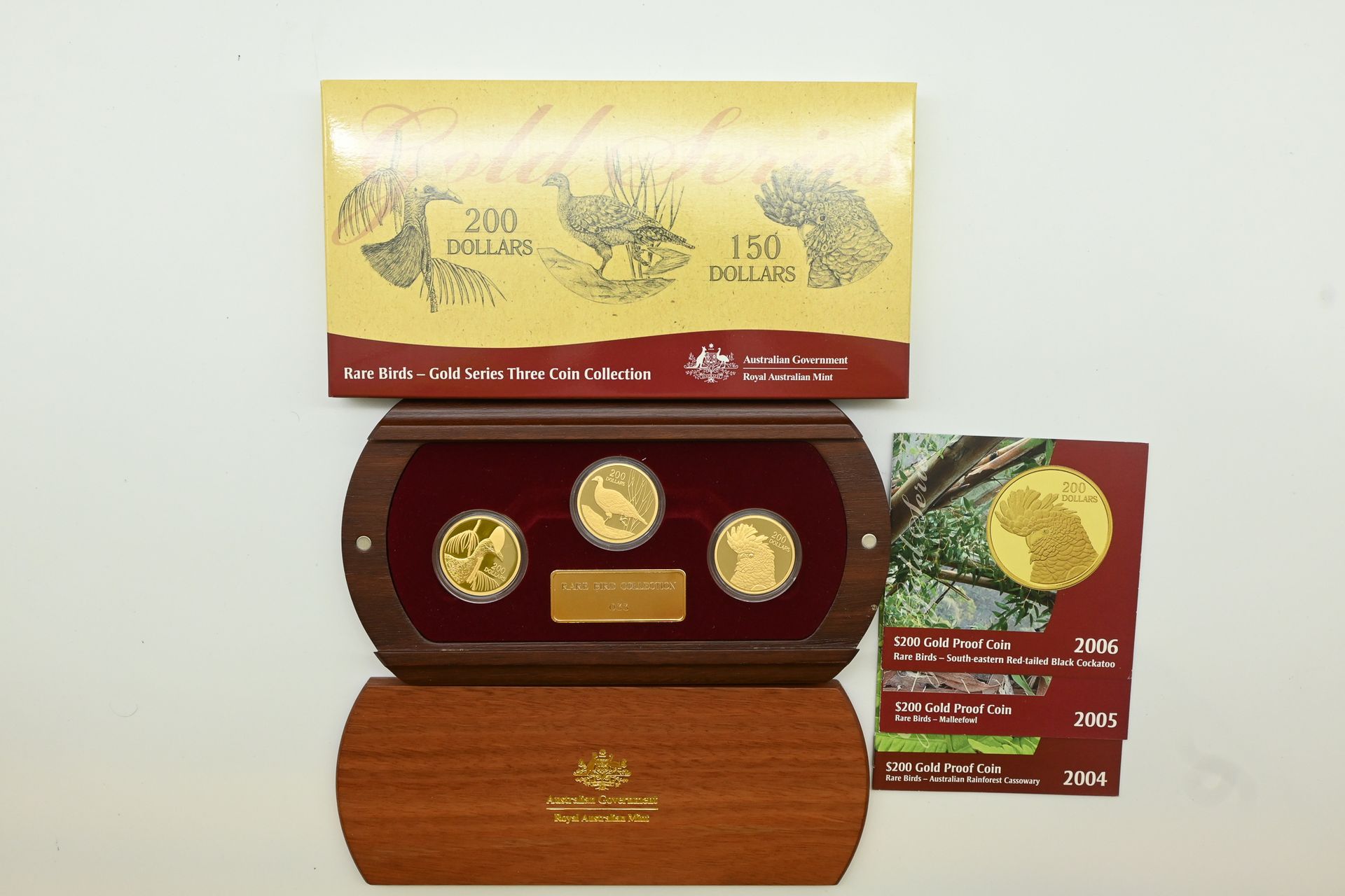 2004–2006 Rare Birds $200 gold proof three-coin collection in its timber display case with certificates, Lot 238 at Copeland Roberts Auction 021