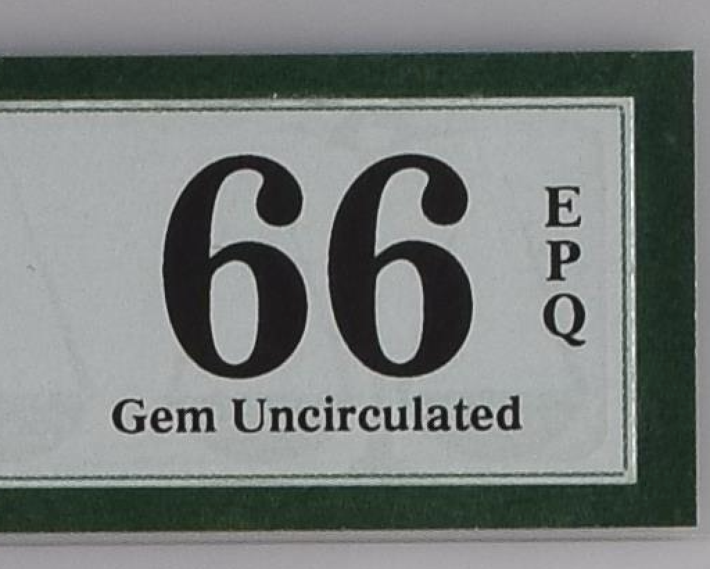 Close-up of the 66 EPQ Gem Uncirculated grade on the genuine PMG label for comparison