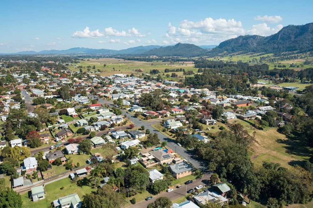 An Aerial View of A Residential Area with Mountains in The Background — MPE Adventure Quads & Bikes In Gloucester, NSW