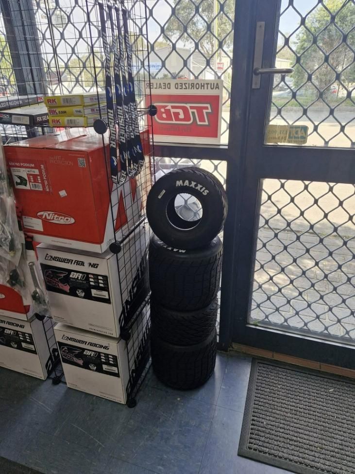 A Stack of Tires Is Sitting on Top of A Stack of Boxes in A Store — MPE Adventure Quads & Bikes In Thornton, NSW