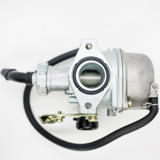 A Silver Carburetor With Pink Fuel Lines, Used for Fuel Mixing in an Engine — MPE Adventure Quads & Bikes In Thornton, NSW