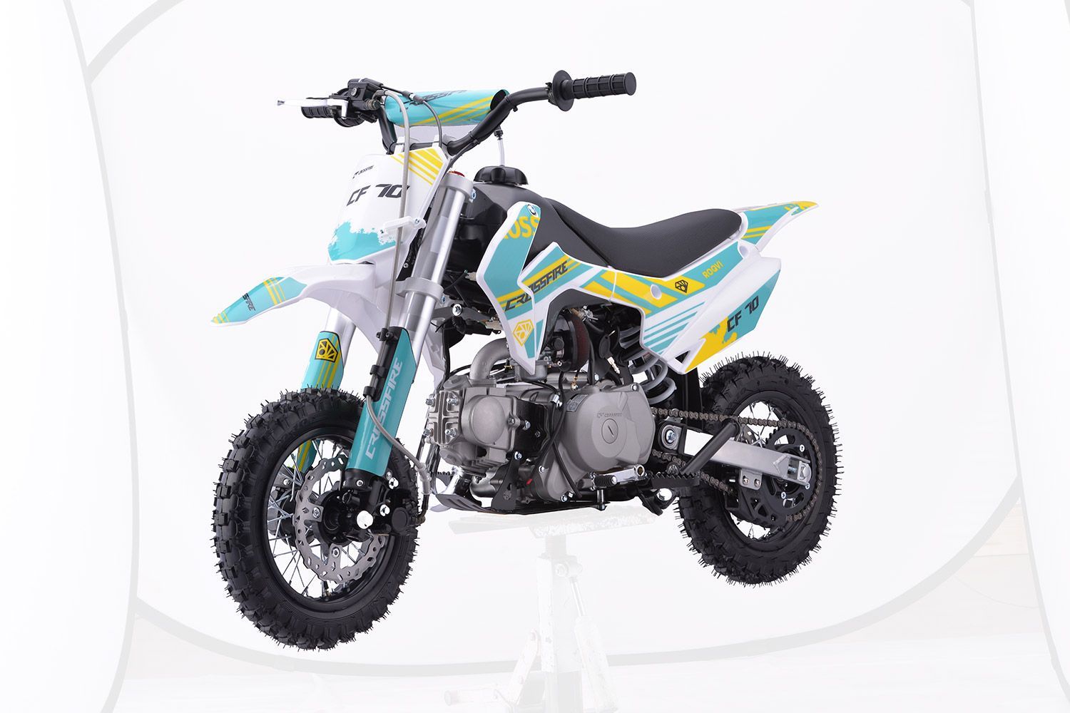 A blue and yellow dirt bike is sitting on a white surface — MPE Adventure Quads & Bikes In Newcastle, NSW