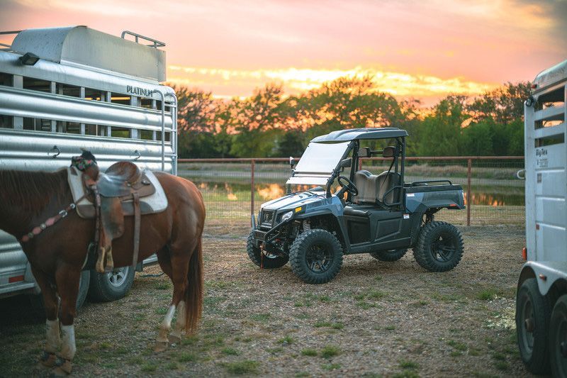 A Atv Is Jumping in The Air on A Dirt Road — MPE Adventure Quads & Bikes In Gloucester, NSW