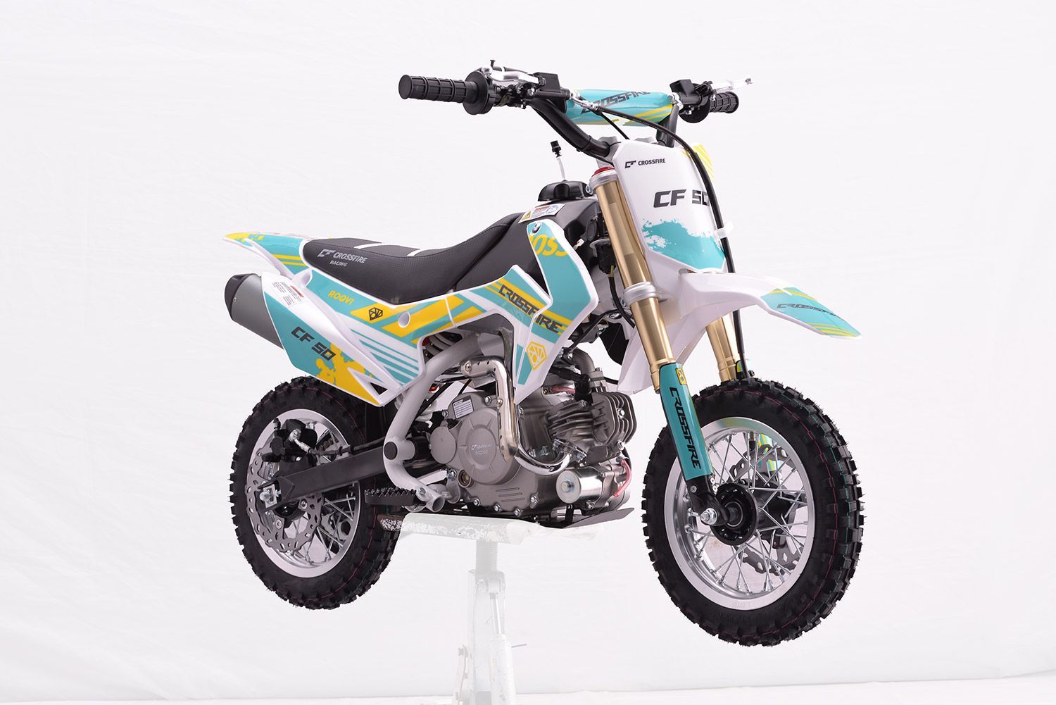 A Small Dirt Bike is Sitting on Top of a White Table — MPE Adventure Quads & Bikes In Cessnock, NSW