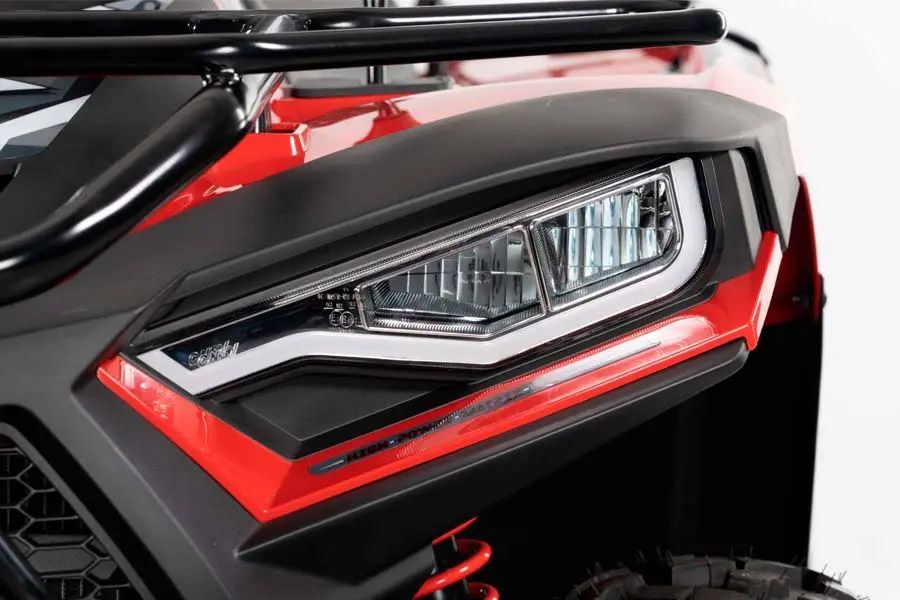 A Close Up of a Red Atv With a Headlight on a White Background — MPE Adventure Quads & Bikes In Forster, NSW
