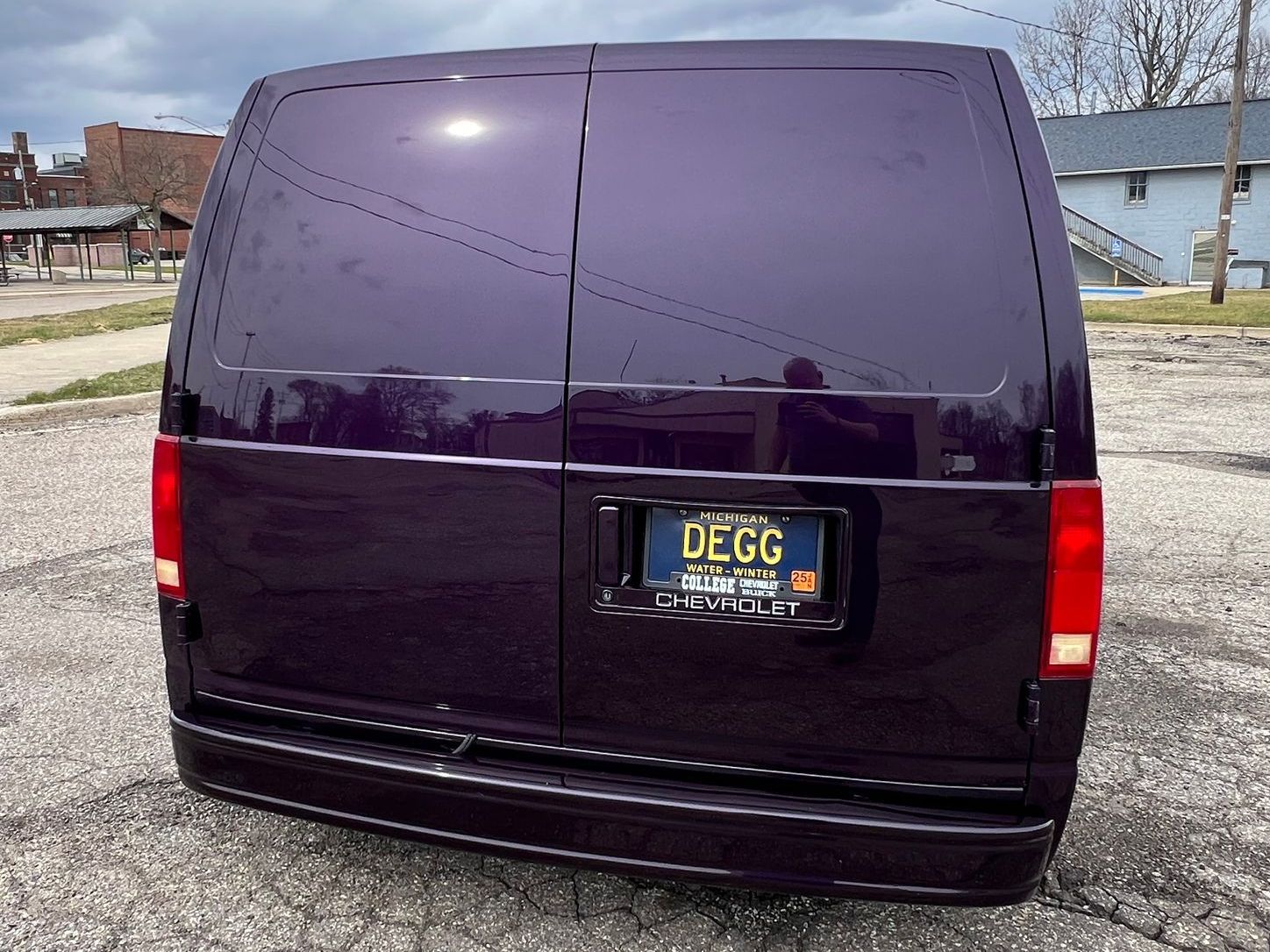 A purple van with a license plate that says ulcc