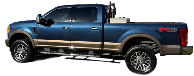 Blue and tan Ford F-350 truck with equipment in the bed and running boards.