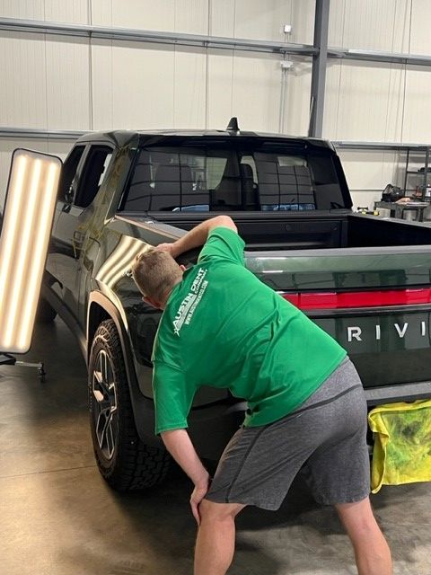 An Austin Dent Company expert applies techniques of paintless dent removal. 