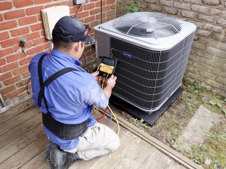 Air conditioning repair on Carrier unit by Alex HVAC Service LLC using diagnostic tools