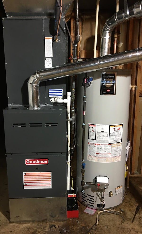 Goodman furnace and water heater installation by Alex HVAC Service LLC in residential basement