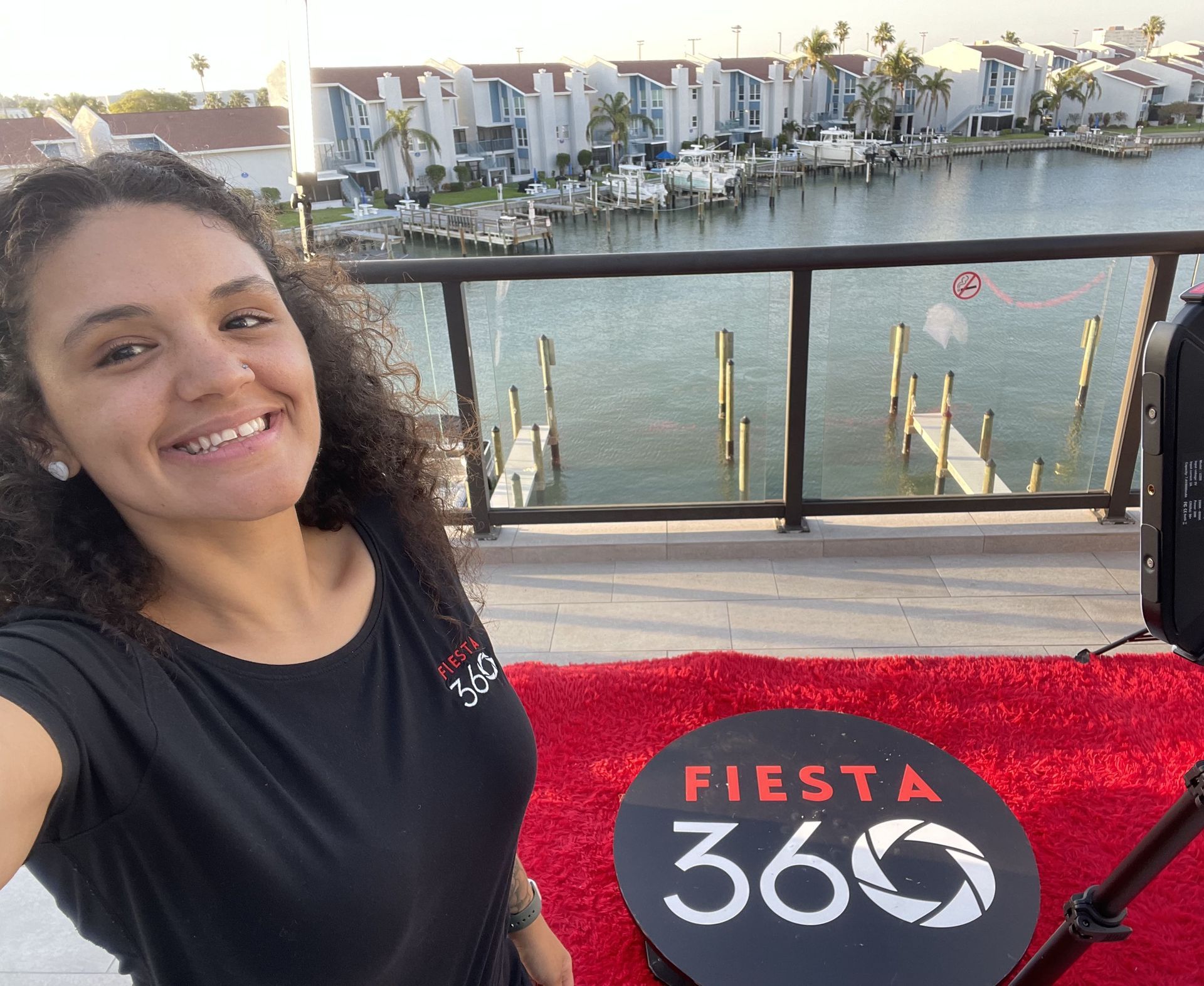 Fiesta 360 team member smiling by Tampa waterfront