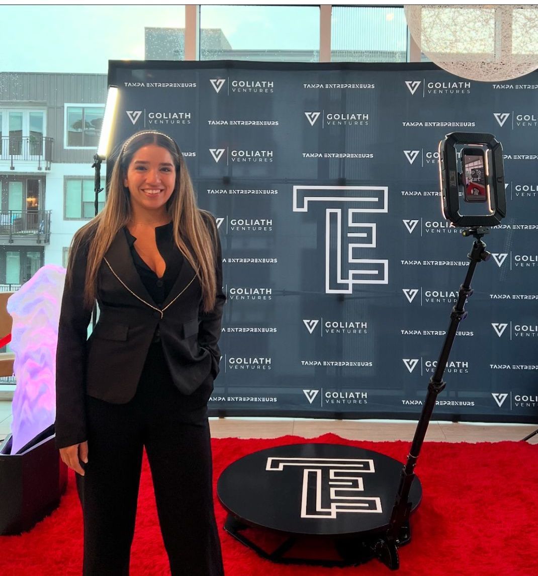 Fiesta 360 team member at Tampa corporate event backdrop