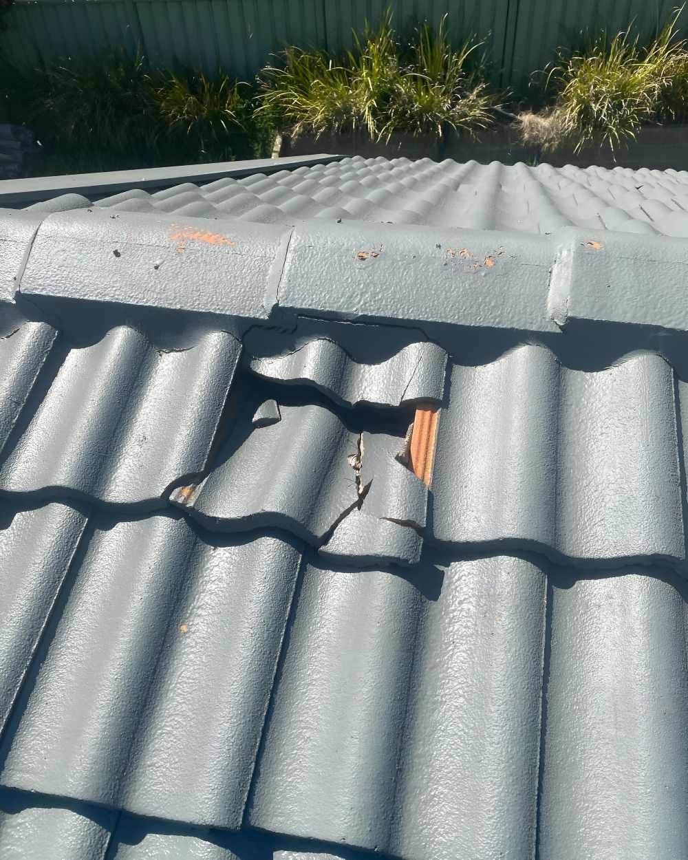 Closed Up Of A Broken Tiled Roof — Lance Ward Roof Tiling in Lithgow, NSW
