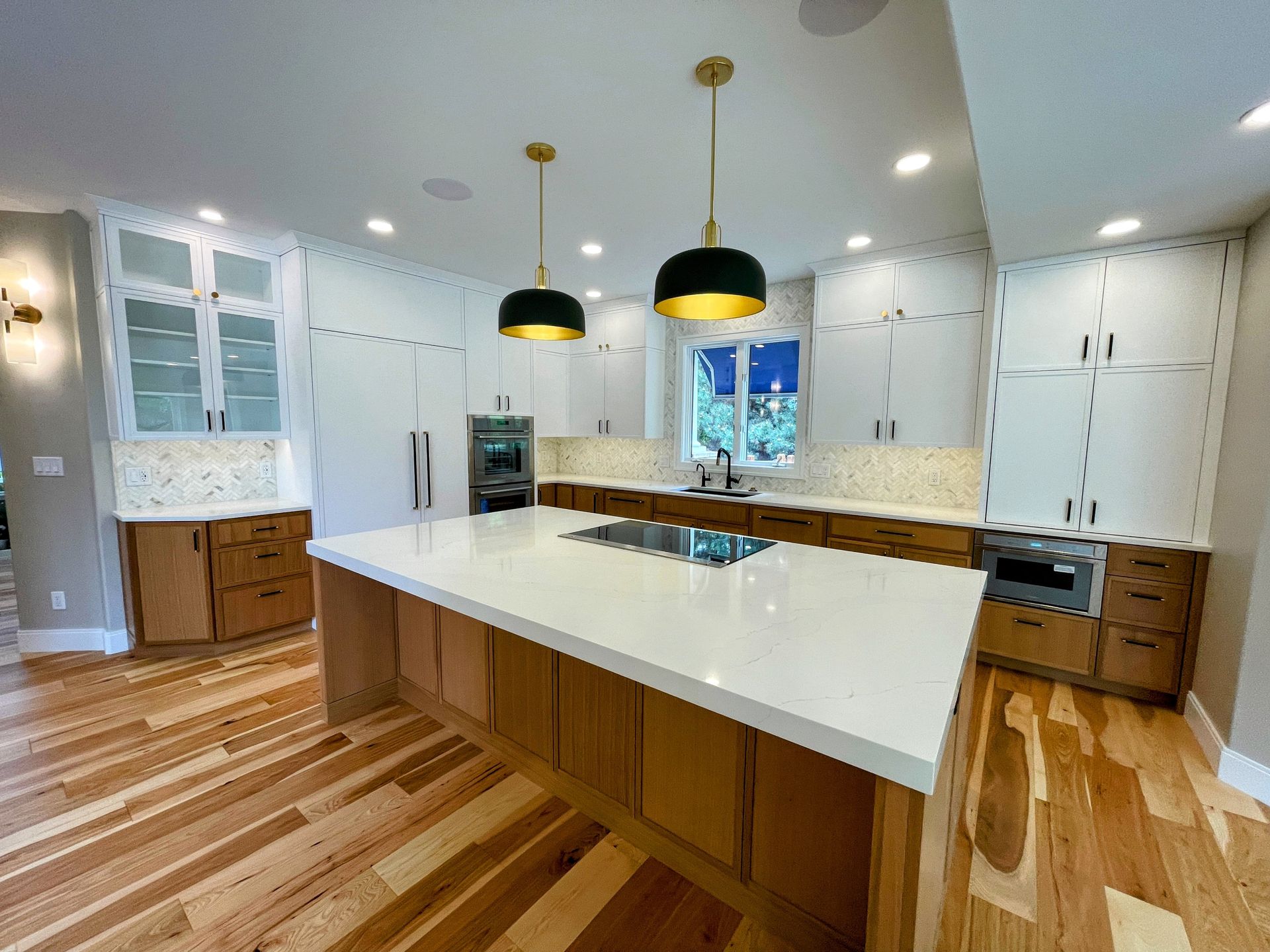 There is a large island in the middle of the kitchen.