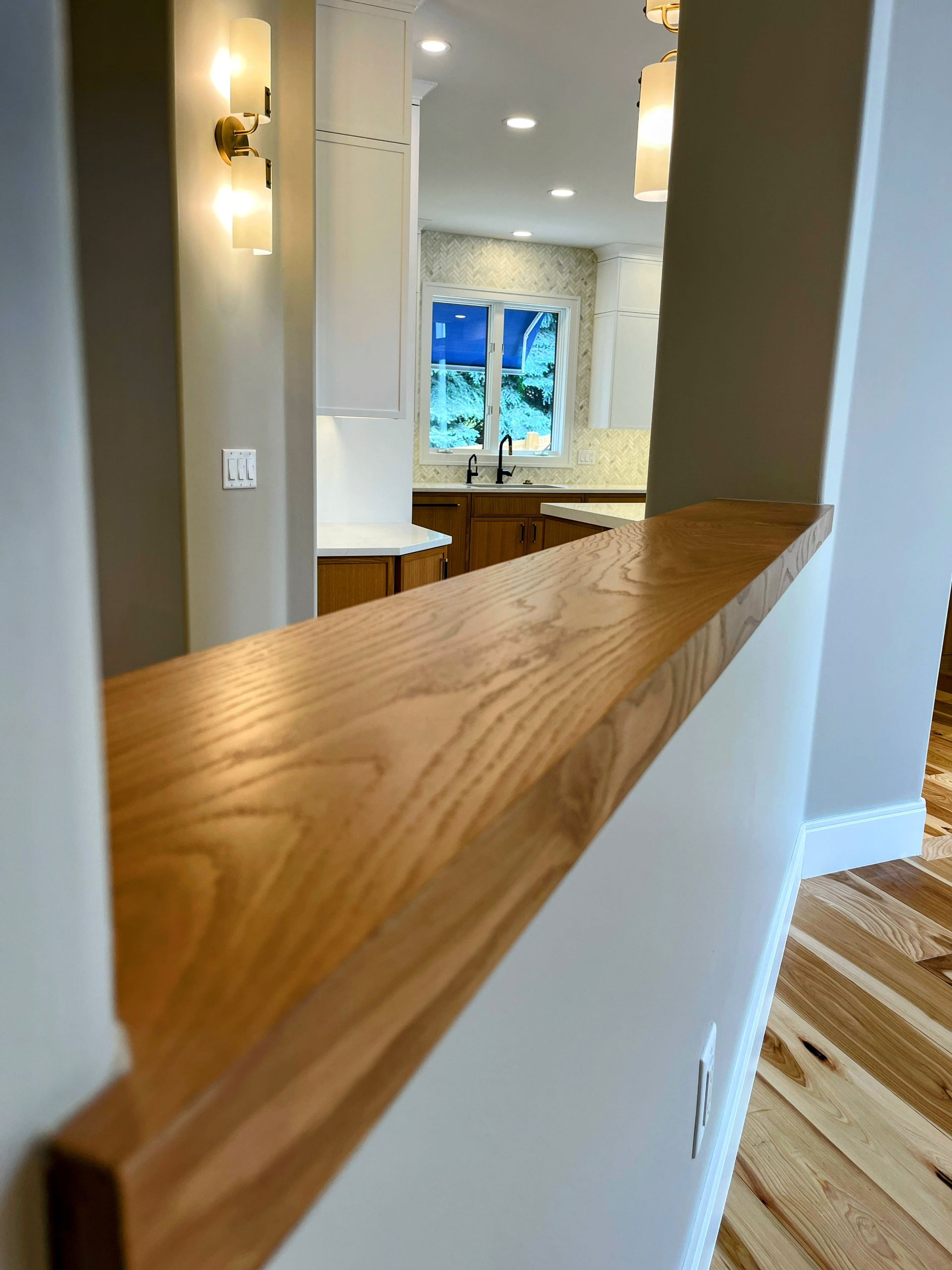 A kitchen with a wooden counter top and a window
