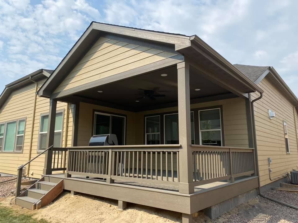 The back of a house with a porch and stairs