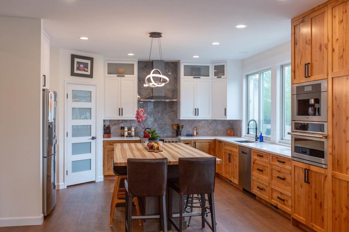 There is a large island in the middle of the kitchen.