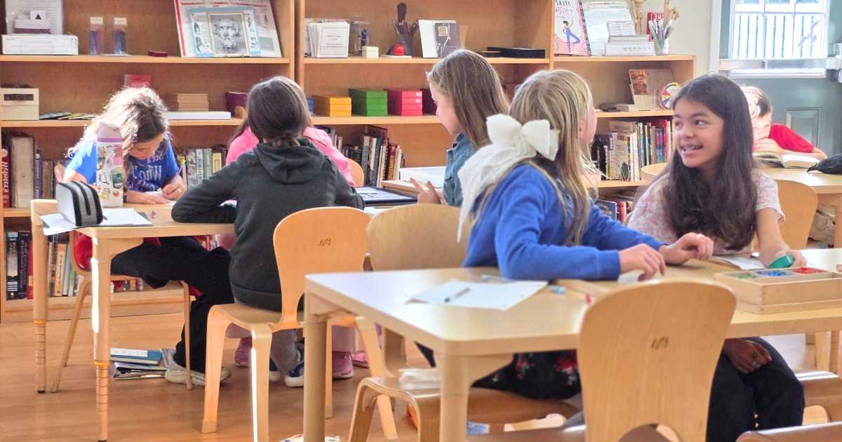 A group of Montessori child working in the classroom