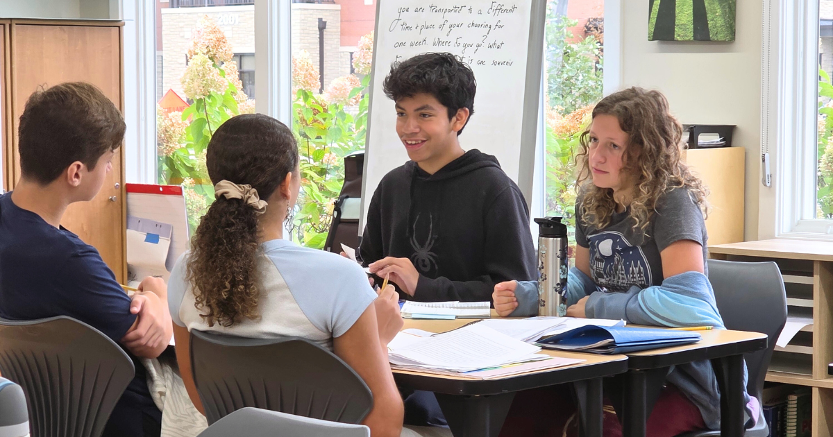 A group of Montessori students working in the classroom