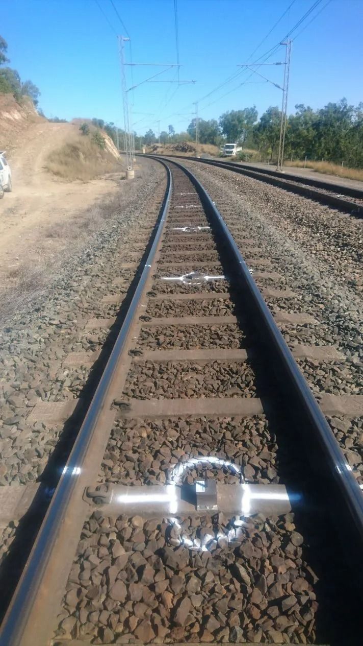 Railroad Tracks Curving Through a Dry Rural Landscape — Coastal Surveying Group Pty Ltd In Baringa, QLD