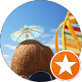 Colorful amusement park ride against blue sky, with a star icon badge in the corner