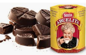 A can of abuelita chocolate next to a pile of chocolate