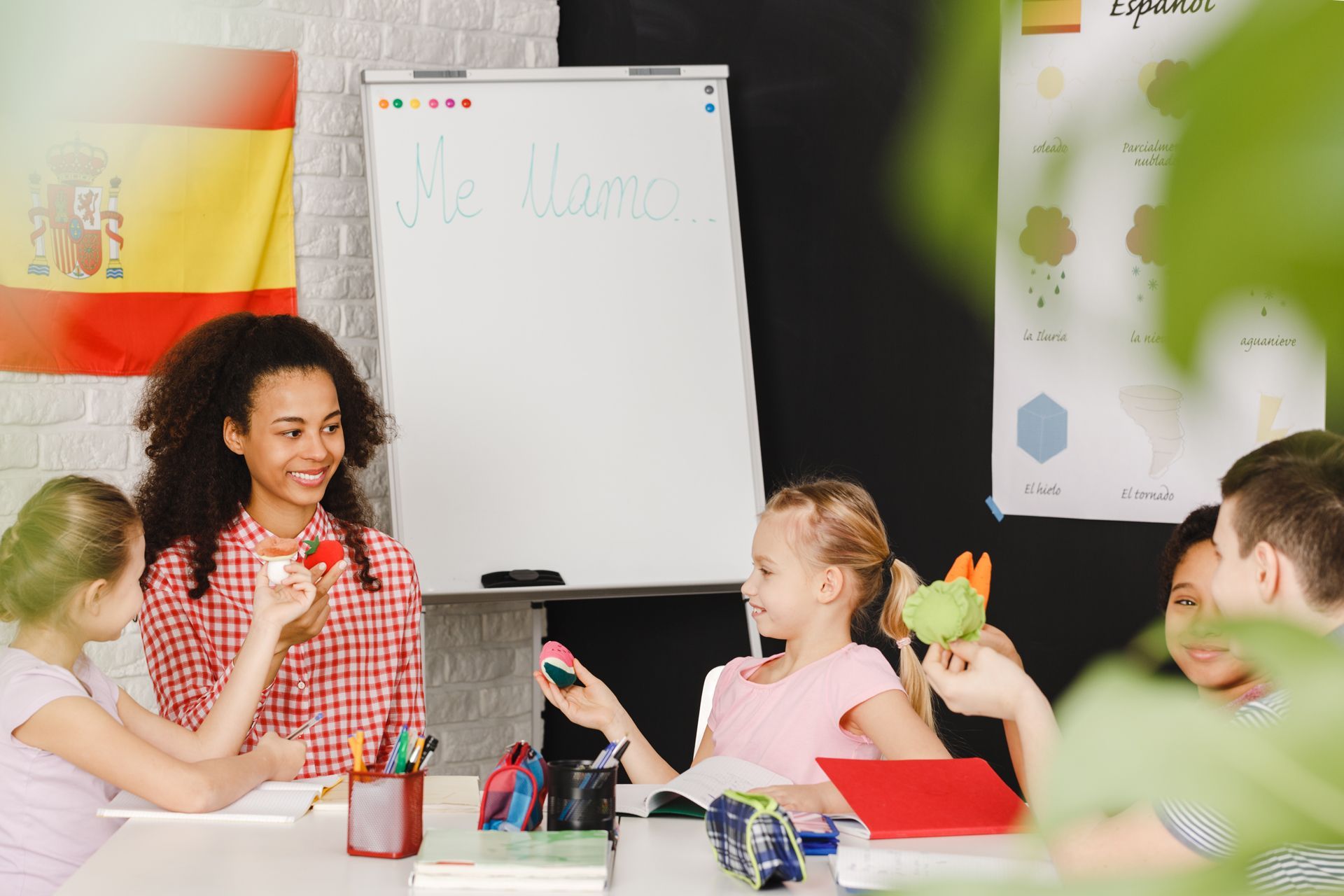 A Group of Children Are Sitting Around a Table in a Classroom
