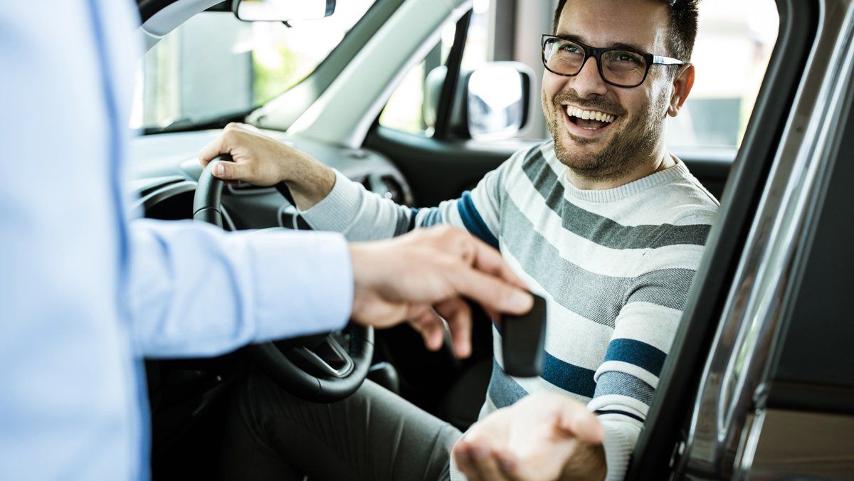 Happy Man On Car — Charlotte, NC — Next Wave Tax Services Happy Man On Car — Charlotte, NC — Next Wave Tax Services