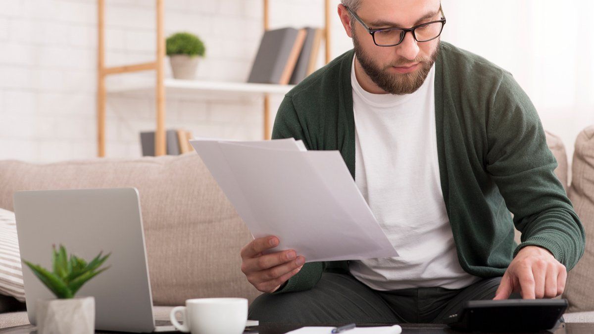 Man Computing Tax — Charlotte, NC — Next Wave Tax Services