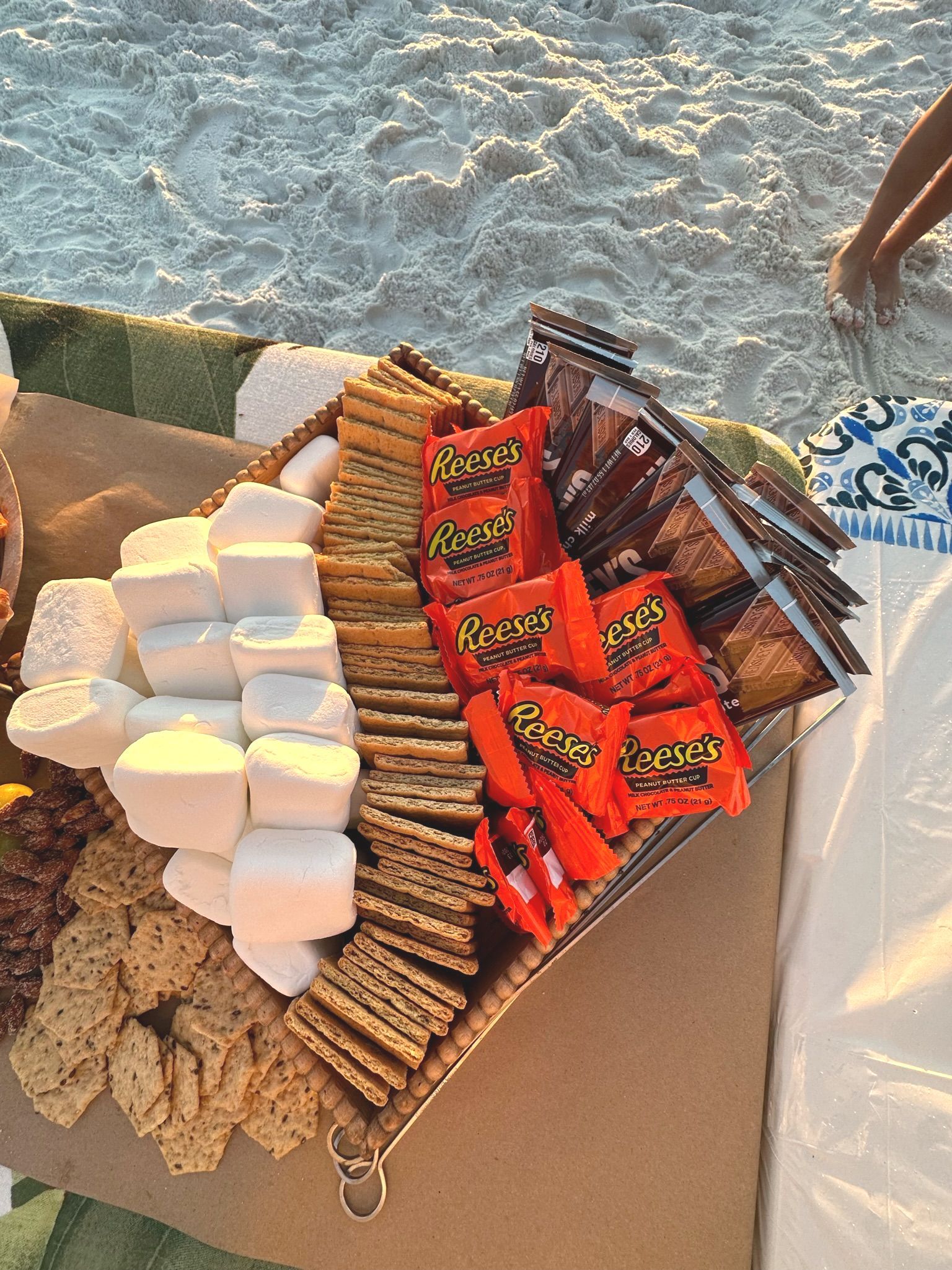 sweet smores charcuterie setup on the beach