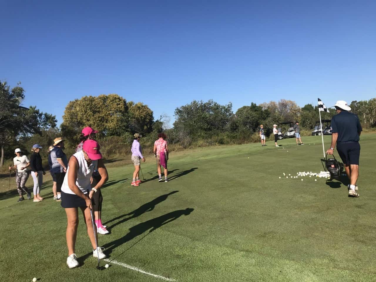 A Group Of People Are Playing Golf On A Golf Course — Rowes Bay Golf Club In Rowes Bay, QLD