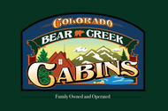 Logo for Bear Creek Cabins in Colorado: cabin, mountains, creek, bear icon.