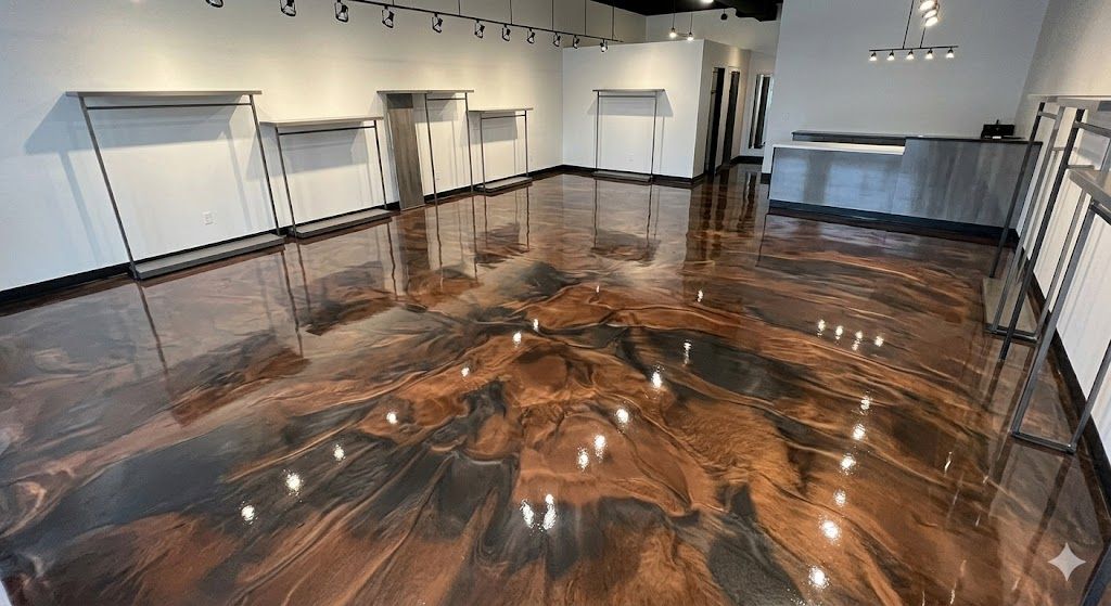 Large room with glossy brown-and-black floor, white walls, and black railings surrounding the space.