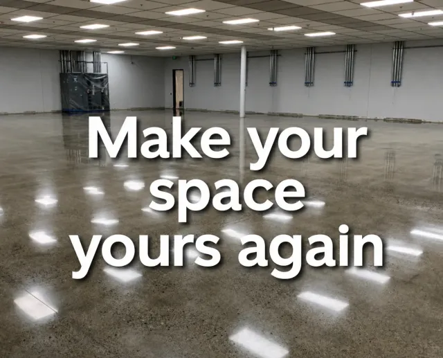 Empty polished room with large white text: “Make your space yours again.”