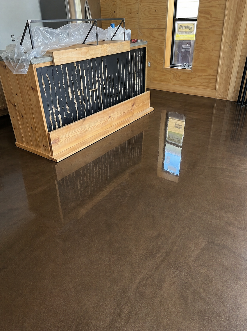 Lobby with a wooden reception counter and glossy reflective floor.