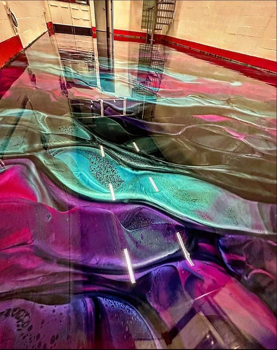 Abstract close-up of glossy layered plastic sheets in magenta, teal, and gold tones