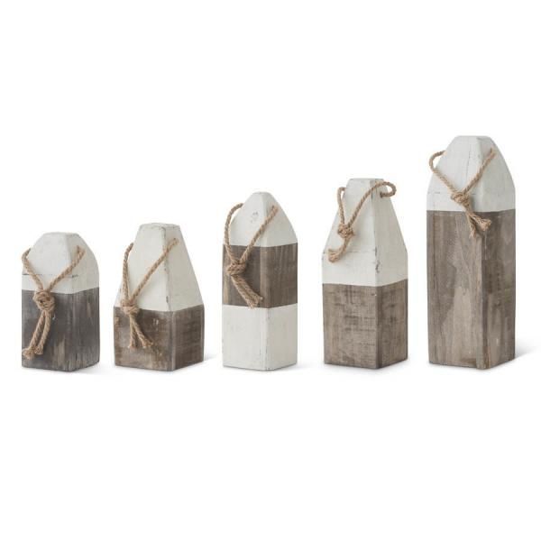 Five rustic wooden decorative houses with white tops and twine bows on a white background