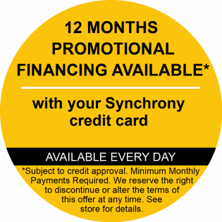 Yellow promotional sign: 12 months financing with Synchrony credit card, available every day.
